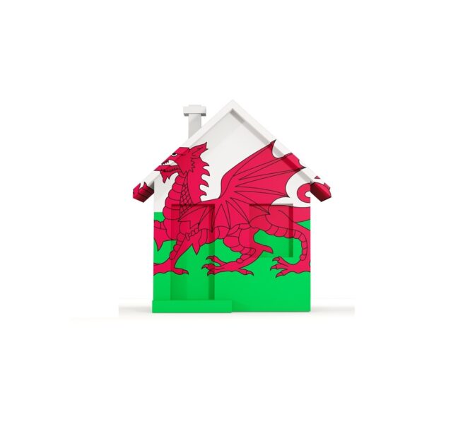 An image of a house covered in the Welsh flag